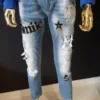 Spodnie jeansowe z ozdobną aplikacją - obrazek 2